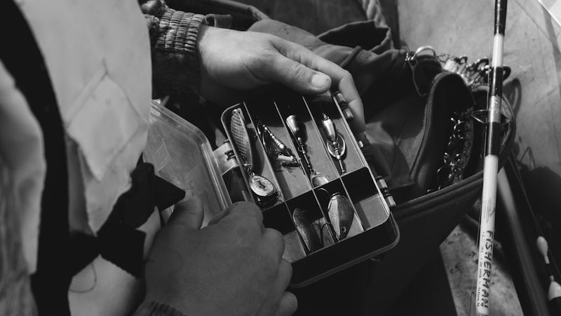 person holding silver and black electric guitar