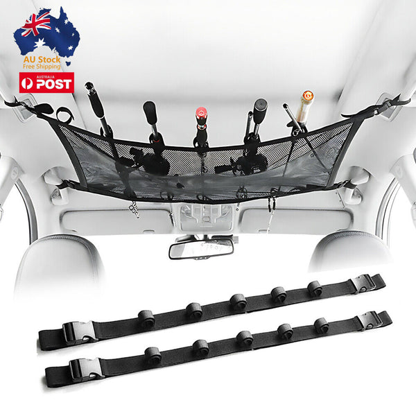 Overhead car fishing rod storage system with black straps holding multiple fishing rods against vehicle roof interior