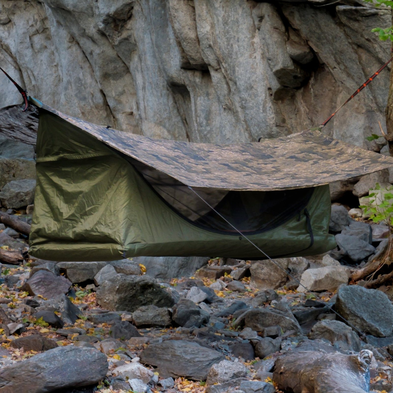 Haven Tent XL lay-flat hammock tent suspended above a boulder field where no tent could pitch