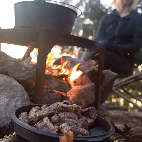 Camp Oven on Crackling Hot Campfire