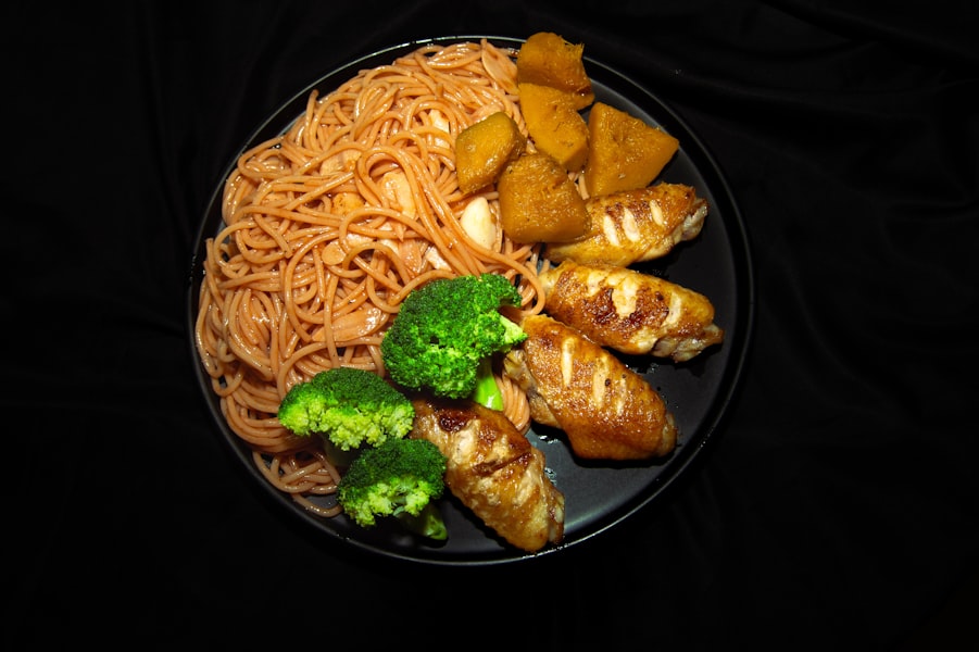 A plate of food with broccoli and noodles