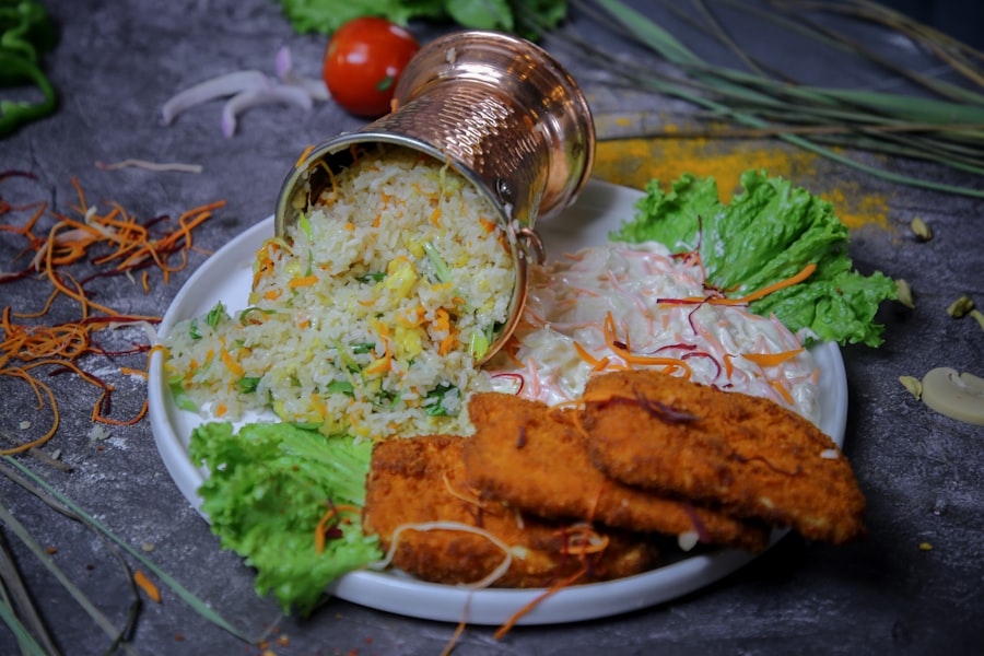 Fried chicken with rice and salad on a plate