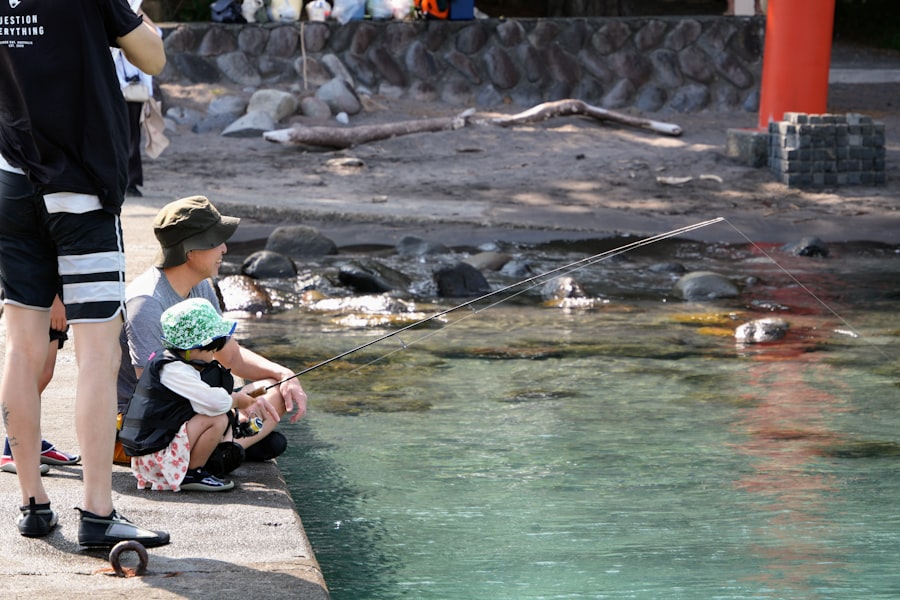 Adult and child by clear water