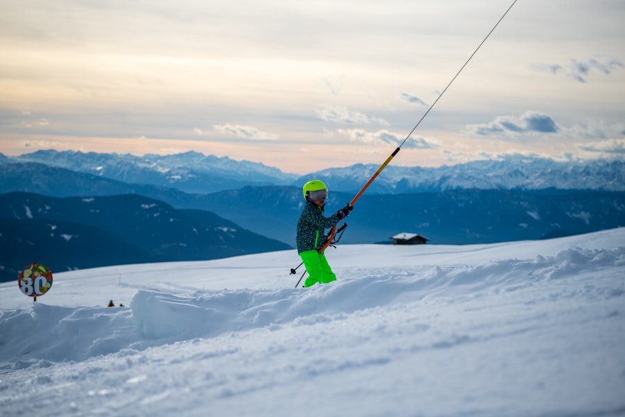 A skier in bright green pants holds ski lift pole