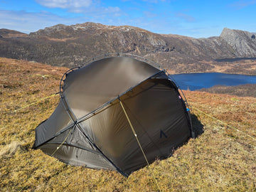 Nortent Vern 2 3S 2-person 3-season hiking tent – pitched with fly closed above a mountain lake