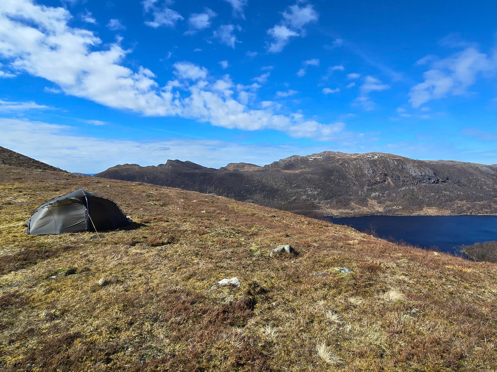 Nortent Vern 2 3S 2-person 3-season hiking tent – pitched on a hillside above a lake, wide landscape