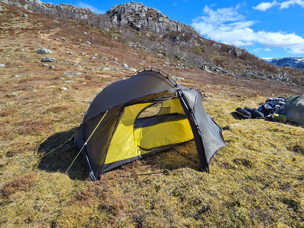 Nortent Vern 2 3S 2-person 3-season hiking tent – pitched beside hiking packs for scale
