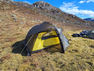 Nortent Vern 2 3S 2-person 3-season hiking tent – pitched beside hiking packs for scale