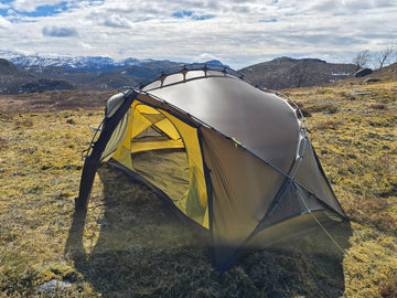 Nortent Vern 2 3S 2-person 3-season hiking tent – end view with inner tent door open below snow-capped mountains