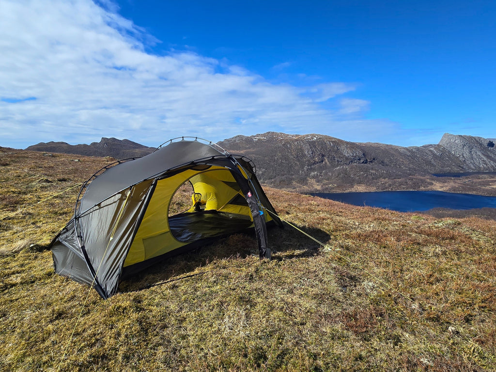 Nortent Vern 2 3S 2-person 3-season hiking tent – wide view pitched above a fjord lake with door open