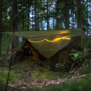 Haven Tent XL at dusk in forest with the Haven RidgeLight strip illuminated along the ridgeline