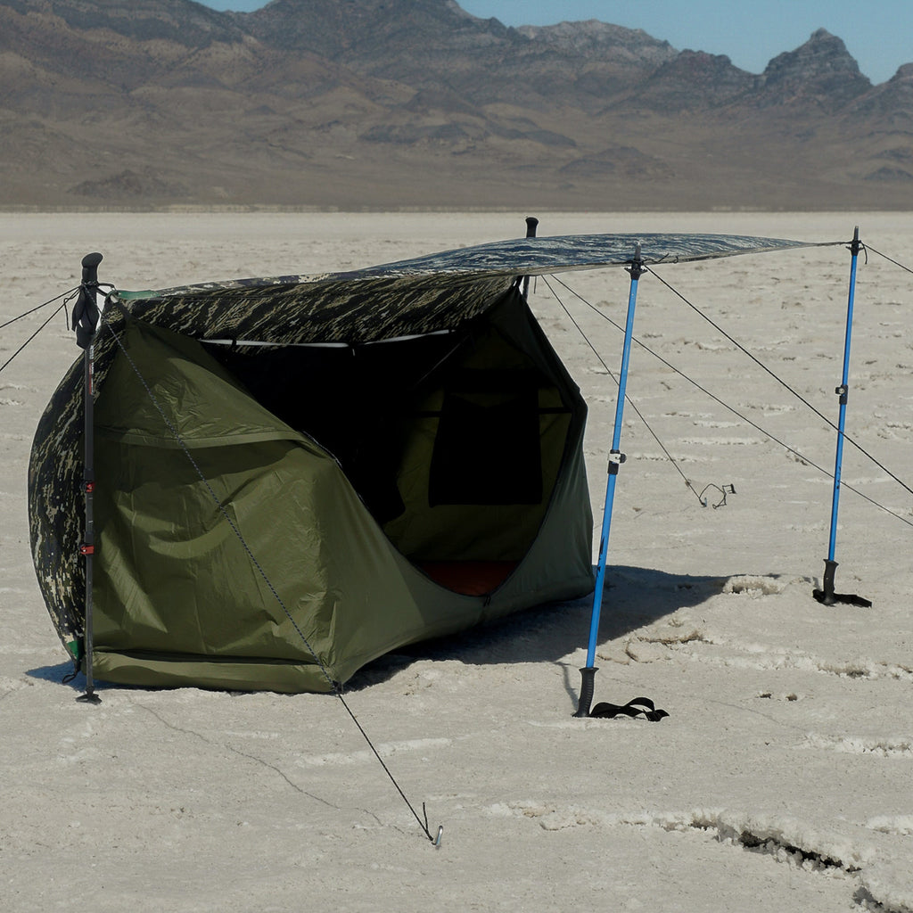 Haven Tent XL pitched on the ground with trekking poles on a treeless salt pan