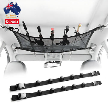 Overhead car fishing rod storage system with black straps holding multiple fishing rods against vehicle roof interior